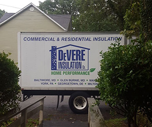 DeVere Insulation truck parked outside.