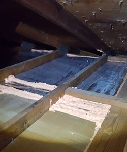 Air sealing in an attic.