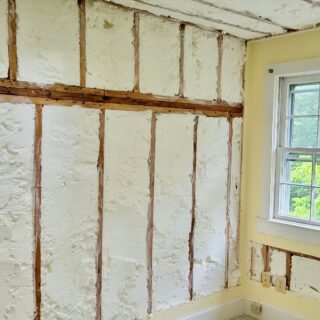 White spray foam insulation inside a home's walls