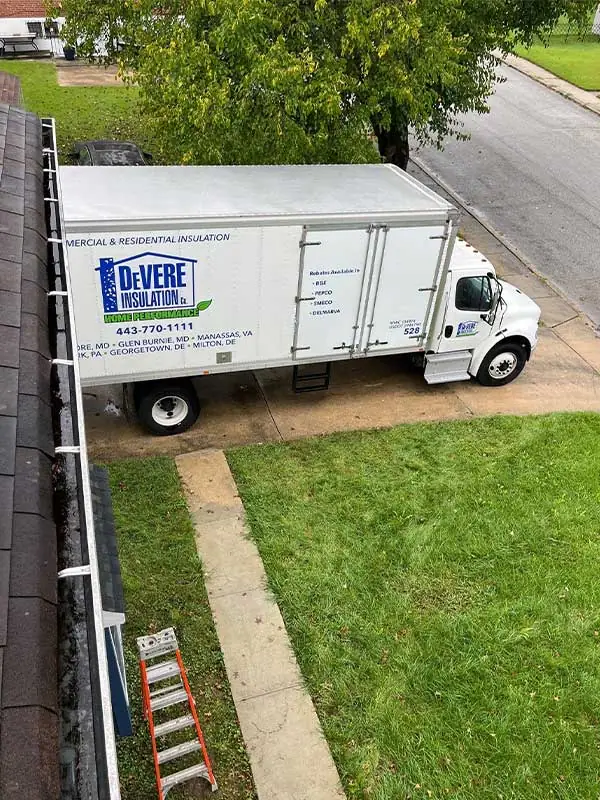 DeVere Insulation fleet truck on-site at a residential insulation installation job, showcasing our professional team and commitment to quality service in every project.