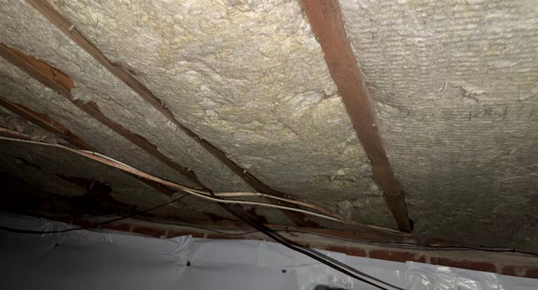 Installed faced batt insulation in attic rafters by DeVere Insulation Home Performance residential install crew.